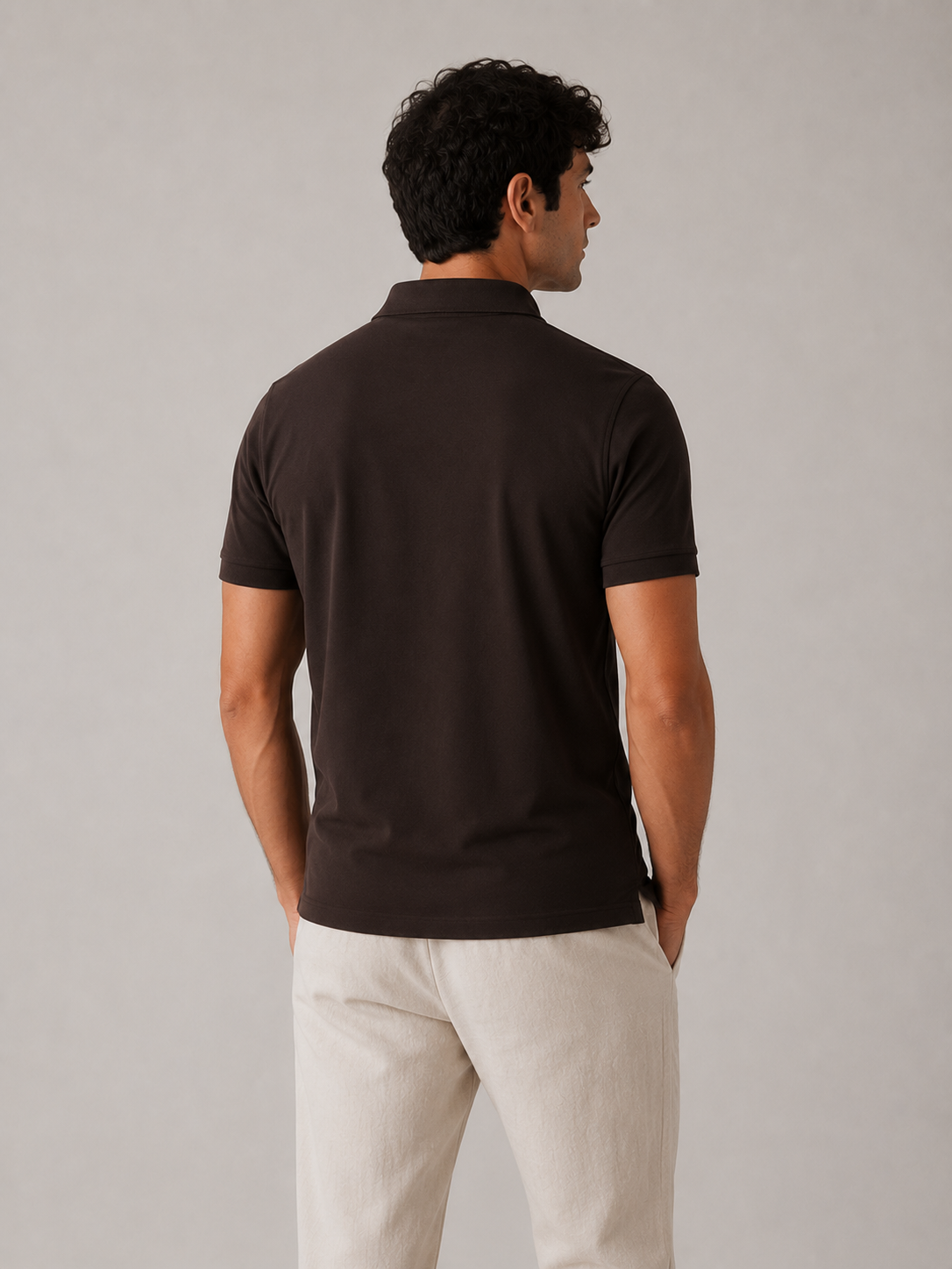 Men’s dark brown Airtex polo shirt, three-quarter back view, smooth shoulder construction