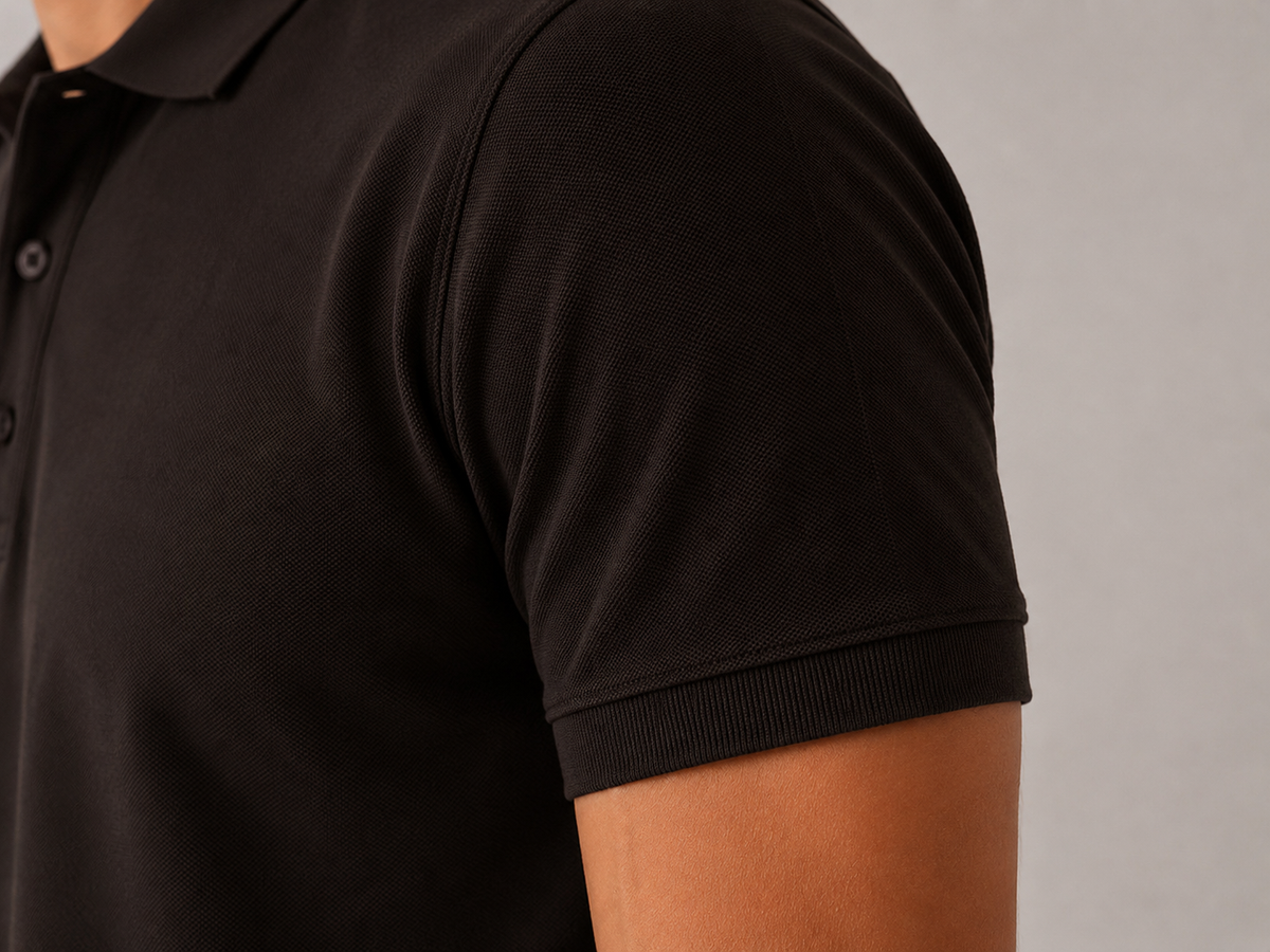 Men’s coffee brown polo shirt, angled close-up view, 220 GSM Airtex piqué weave and stitching