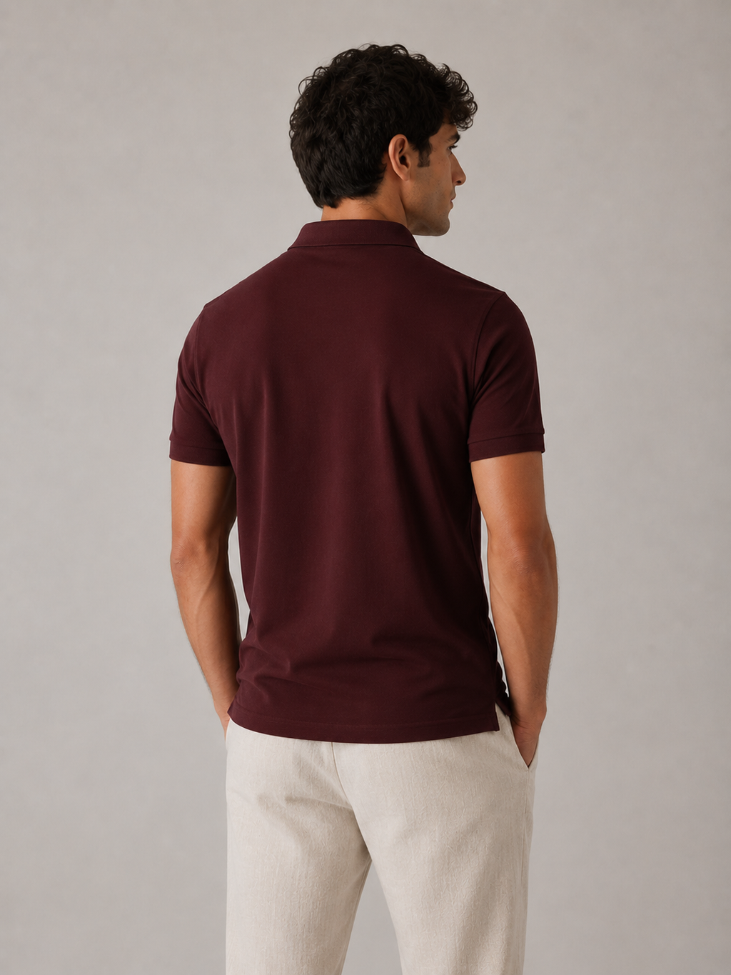 Men’s deep maroon cotton polo shirt, back view on model, tailored shoulder and clean drape