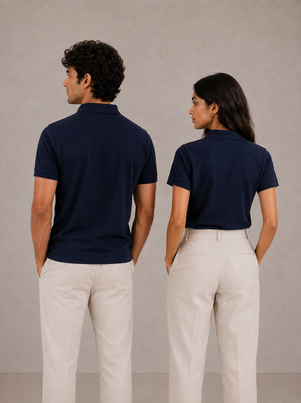 Matching navy cotton polo shirt set, side profile view on couple, relaxed-tapered fit drape
